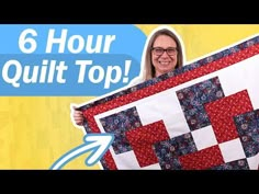 a woman holding up a red and white quilt with the words 6 hour quilt top