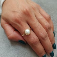 Delicate Pearl Gold ring, 14k Solid Gold. This handmade gold engagement ring with Pearl is made of 14K genuine gold and set with pearl.  This 14-karat gold ring can serve as an engagement ring or a birthday gift, bridesmaid. * Gemstone -Natural pear    pearl size: Pearl 8 mm round. * Metal - 14K genuine gold. * Beautifully packaged, ready for gift giving. I make all my items with care and professionalism which I learnt from my father and grandfather. I am 4 generation of jewelers, and all my kno Engagement Ring With Pearl, Pearl Gold Ring, Ring With Pearl, Mommy Things, Pearl Engagement Ring, Pearl Rings, Monogram Ring, Etsy Gold Ring, Courthouse Wedding