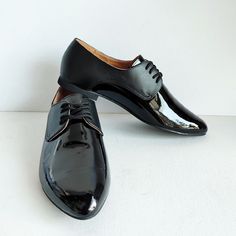 Black Plain Toe Lace-up Party Shoes, Black Plain Toe Lace-up Shoes For Party, Black Plain Toe Oxfords For Party, Black Dress Shoes With Flat Heel For Party, Black Flat Heel Dress Shoes For Party, Black Leather Shoes With Round Toe For Party, Black Leather Party Shoes With Rubber Sole, Black Oxfords With Rubber Sole For Party, Black Plain Toe Dress Shoes For Party