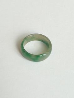 Sweet Green Jadeite Ring, Dainty Handcrafted Jade, Perfectly Polished Jadeite, Gift for Father This saddle jadeite ring features contemporary craftsmanship is made from natural untreated Burmese jadeite. It is polished for a high shine. Dimension (in this picture): Inner diameter: 19.10 mm Thickness: 2.52 mm Width: 7.55 mm Weight: 17.42 carat Ring Size: US 9.0 Everything is handcrafted with exceptional care in Hong Kong. Item is wrapped in beautiful box! Styling & Care: - Avoid direct contac Green Ring For Gift, Green Round Band Ring For Gift, Green Round Band Ring As Gift, Green Round Band Rings As A Gift, Classic Green Crystal Ring, Green Crystal Ring Gift, Green Crystal Round Band Ring As Gift, Green Round Promise Ring, Green Crystal Round Promise Ring