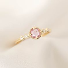 4.5mm Natural sapphire, unheated & untreated 0.04ctw G color SI clarity accent diamonds Band width: approx. 1.3mm Low profile four prongs setting Made of 100% recycled solid 14k gold and ethically sourced gemstones Colors may vary slightly as they are genuine gemstones Elegant Pink Sapphire Ring With Center Stone, Pink Sapphire Ring With Rose Cut Diamonds, Round Pink Sapphire Ring With Rose Cut Diamonds, Elegant Pink Amethyst Ring With Halo Setting, Elegant Pink Sapphire Ring With Rose Cut Diamonds, Pink Sapphire Promise Ring With Halo Setting, Pink Sapphire Gemstone Rings, Gift Pink Sapphire Ring With Rose Cut Diamonds, Elegant Rings With Rose Cut Pink Sapphire