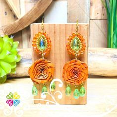 Perfect flower earrings for the beach, a picnic in the park or to wear your favorite cultural/casual outfit.   This earrings is 100% handwoven by Mexican artisans using sustainable and biodegradable materials such as palm leaves and cotton threads. The hoops are decorated with palm flowers and sparking beads.  You will love how this earrings uplift your spirits with the vibrant colors! Approximate Length: 2 in  Please note that these earrings are handmade, shapes, colors, and sizes may vary slig Bohemian Summer Flower Earrings, Bohemian Flower Earrings For Summer, Summer Festival Woven Earrings, Woven Earrings For Summer Festivals, Spring Natural Color Jewelry Gift, Natural Color Spring Jewelry Gift, Natural Jewelry Gift For Spring, Spring Gift Jewelry In Natural Color, Bohemian Flower Earrings For Vacation