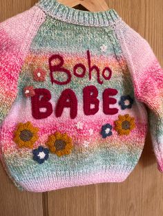 🌺Boho Babe 🌺✌️ This hand embellished, hand knitted cardigan is perfect for your little boho babe. Know anyone going to a festival this summer? This could be a lovely little cardi for them! 🎪🎶 It's knitted in a beautiful rainbow colourway with a comfortable fit and little pink flower buttons This cardigan comfortably fits size 12-18 months, it could even fit up to 2 years. Measurements to follow Bohemian Knitted Cardigan For Festivals, Bohemian Knitted Beach Sweater, Bohemian Knit Sweater For Beach, Casual Handmade Cardigan For Festivals, Handmade Casual Festival Cardigan, Bohemian Beach Sweater, Pink Bohemian Knit Cardigan, Handmade Hippie Cardigan For Spring, Bohemian Pink Knit Cardigan