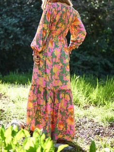 Be the life of the garden party in this Olive Floral Maxi. The playful smocked bodice and long balloon sleeves add a touch of whimsy to this elegant maxi dress. Perfect for any occasion, this dress will have you blooming with confidence.