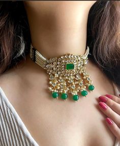 Adorn yourself in timeless elegance with this exquisite Rani pink Kundan necklace set, perfect for weddings and special occasions. Crafted with meticulous attention to detail, the set features vibrant green and golden hues reminiscent of Pakistani and Punjabi traditions, with a touch of Bollywood glamour. Complete with matching earrings and a stunning maangtika, this Indian Kundan ensemble effortlessly captures the essence of sophistication and grace. Measurements:  Necklace weight: 75 gms  Leng Intricate Kundan Choker Jewelry, Bollywood Style Cutdana Choker Jewelry, Bollywood Style Cutdana Choker, Wedding Choker With Cutdana Detail, Eid Kundan Jewelry Gift, Round Kundan Jewelry For Eid, Hand Set Bollywood Style Choker Jewelry, Green Cutdana Choker Jewelry, Traditional Wedding Choker Jewelry