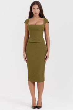 Details 
 Layana Olive Corset Midi Dress is incredibly chic. Cut from peached twill for a softly brushed texture, it features a corseted bodice to cinch the waist and is topped with a flattering square neckline and dainty cap sleeves.

We love how the fitted skirt falls to a classy long midi length as it skims over your curves and has a split to the back for easy movement. 'Layana' is fully lined for comfort and zips up the back for easy on. 
 Size Chart
             BUST WAIST HIP LENGTH   XS 8 เสื้อผ้า Kylie Jenner, Corset Midi Dress, Bodycon Midi Skirt, French Dress, Office Dresses For Women, Square Neck Top, Mid Length Skirts, Fall Skirts, Sleeveless Crop Top