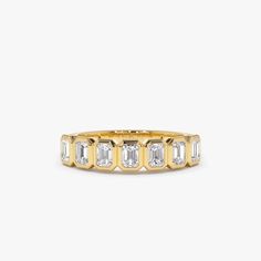 "14k Bezel Setting Emerald Cut Diamond Wedding Band / Emerald Cut Wedding Band 0.75 Ctw Genuine Emerald Cut Diamond Anniversary Ring by Ferko's Fine Jewelry Gold Kt: 14K (Please message me if you want 18K) Custom Gold Color: Rose Gold, Yellow Gold, White Gold EmeraldCut Diamond: 7 pcs 3.5 x 2.5 MM Total CTW: 0.75 CTW Ctw Diamond Color-Clarity: G Color Si Clarity Setting Type: Bezel Band Width: Starts off at 3MM and graduates down to 2MM If you have any additional questions about this ring, just Bezel Diamond Band, Wedding Band Emerald Cut, Bezel Wedding Band, Bezel Set Diamond Band, Emerald Cut Wedding Band, Bezel Set Wedding Band, Wedding Stack, Bezel Band, Diamond Anniversary Ring