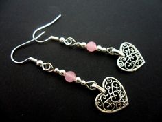 This a pair of pretty tibetan silver dangly heart earrings. Made with 4mm pink jade beads. Measure approx. 4cm from top of hook to bottom of earring. Freshly made by me and unworn. Thanks for looking!! Sterling Silver Heart Beads Dangle Jewelry, Valentine's Day Beaded Metal Jewelry, Silver Heart Beads Dangle Jewelry, Silver Dangle Heart Beads Jewelry, Sterling Silver Heart Beads Dangle Earrings, Silver Dangle Jewelry With Heart Beads, Heart Beads Metal Earrings For Gift, Metal Heart Beads Earrings For Gifts, Handmade Adjustable Drop Heart Earrings