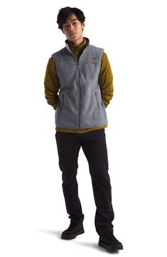 An ideal layer for cool-weather days, the zip fleece vest is the everyday layer you can wear to work or out in the wilderness. 26 1/2" length Front zip closure Stand collar Front zip pockets 330 g/m² fleece double knit 100% recycled polyester Machine wash, tumble dry Imported Weather Day, Wear To Work, The Wilderness, Fleece Vest, Double Knit, Double Knitting, Stand Collar, Heathers, North Face