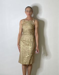 "An exceptional Y2K designer vintage dinner or cocktail dress in gold.  The fabric here is so unique - it is textured and there are panels of different plain textured metallic fabric. Amazing details and elegant classic silhouette.  Size  12 1/4\" waist 38 1/4\" long  XXS  Condition Worn seldom, light pilling very occasional seen on close up examination only. Presents beautifully.  Model is  24\" waist 5' 6\" 54kg SHIPPING PLEASE READ This item is located in Australia - we charge only the actual postage cost to send internationally. Once any item is sent if the postage charged is higher than we paid we will refund any difference. In most cases the postage cost will be higher than our postal charges - the fact is that postage is expensive and international postage for garments or heavier it Gold Evening Dress, Vintage Dinner, Gold Evening Dresses, Gold Lame, Dress Gold, Metallic Fabric, Dress Cocktail, Wiggle Dress, Designer Vintage