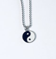 "Yin & Yang necklace, Yin and Yang necklace, unisex black and white with silver charm, on a ball chain necklace which is STAINLESS STEEL. Boho chic bohemian. Occult esoteric jewelry 💕 Yin & Yang is a concept of dualism with its roots in Taoism/ philosophy. The Yin or dark side is associated with shadows, femininity & the trough of a wave, the Yang or light side represents brightness, passion & growth, both sides present duality, both sides work together. *this is a super cute ne Symbolic Black Necklace With Adjustable Chain, Symbolic Black Jewelry With Adjustable Chain, Black Symbolic Jewelry With Adjustable Chain, Symbolic Black Stainless Steel Necklace, Trendy Black Sterling Silver Necklace, Trendy Black Nickel-free Necklace, Hypoallergenic Black Stainless Steel Necklace, Adjustable Hypoallergenic Black Necklace, Black Clavicle Chain Charm Necklace