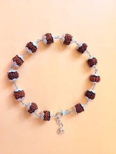 "Giglirigli Gems" Welcomes you "Valuable Rudraksha Bracelet, Gemstone Bracelet, Brown Statement Bracelet, 925 Sterling Silver Jewelry, Anniversary Gift, Bracelet For Wife" Metal : 925 Sterling Silver Pearl Pendants https://www.etsy.com/shop/Giglirigligems?ref=seller-platform-mcnav&search_query=Pearl+pendants Pearl Earrings https://www.etsy.com/shop/Giglirigligems?ref=seller-platform-mcnav&search_query=Pearl+earrings Pearl Ring https://www.etsy.com/shop/Giglirigligems?ref=seller-platform-mcnav&search_query=Pearl+ring A complete hub of Silver/Gold Jewelry & Gemstone Manufacturing Our Ability - 1000 Pieces per week &CAD/CAM Designing,Wire Wrapped Jewelry ,Rhodium Plating ,Micron plating,Grain Setting etc We are any Design as per your Requirement Payment policy We accept the payment via paypal Adjustable Silver Bracelets For Festivals, Adjustable Sterling Silver Beaded Fusion Bracelets, Symbolic Sterling Silver Bracelets For Festivals, Spiritual Silver Beads Bracelet As Gift, Sterling Silver Hand-strung Jewelry For Gifts, Sterling Silver Bracelets With Round Beads As Gift, Hand-strung Sterling Silver Jewelry As Gift, Adjustable Spiritual Jewelry For Puja, Sterling Silver Rosary Bracelet With Round Beads As Gift