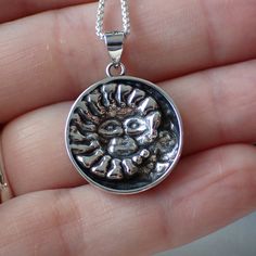 This is a very beautiful sterling silver celestial charm with a detailed sun and moon. It measures 1.1” long including the bail and .8" wide. This charm is photographed on a 1 mm sterling silver rounded box chain which is sold separately. It can be found here. Silver Jewelry With Sun And Moon Design For Gift, Sterling Silver Jewelry With Sun And Moon Design, Silver Medallion Jewelry With Moon Phase, Symbolic Silver Jewelry With Sun And Moon Design, Sun And Moon Design Medallion Jewelry As Gift, Medallion Jewelry With Sun And Moon Design As Gift, Silver Sun Design Jewelry As A Gift, Celestial Medallion Silver Jewelry, Sun And Moon Design Medallion Jewelry Gift