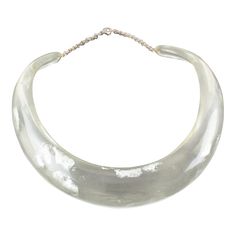 This is part of Chairish’s Costume Jewelry assortment.  An elegant Italian artisan designer studio collar choker necklace.  Lucite or resin rigid bib shape in translucent clear color ornate with silver flakes inclusions in an organic abstract free-form design. Silvered metal chain to adjust the length. No visible maker's mark. Measurements: The inner circumference is 16.57 in (42 cm) - the front height is 1 in (2.6 cm) - the opening is 3.38 in (8.5 cm) - the necklace will fit an average 14.57 in Formal Clear Lucite Jewelry, Organic Abstract, Vintage Choker Necklace, Collar Choker, Bib Collar, Designer Studio, Vintage Choker, Transparent Resin, Form Design