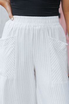 These linen wide leg pants are perfect for everyday wear and beach vacations! Expertly crafted with a smocked waistband and front pockets, these Oatmeal Striped Linen Wide Leg Pants offer both style and functionality. The frayed detail adds a touch of edginess, while the blend of 55% linen and 45% rayon ensures comfort and durability. Perfect for any occasion! Style with a basic tank top, comfy slide sandals, and a woven crossbody bag for a chic vacay-ready outfit! Linen Wide Leg Pants, Wide Leg Linen Pants, Beach Vacations, Striped Linen, Basic Tank, Slide Sandals, Basic Tank Top, Leg Pants, Final Sale