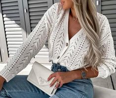 50% Cotton and 50% Acrylic. This cardigan is available in approx. sizes of: One Size (UK 8-14 - fits between size 8 up to size 14) , an approx. length of 27"(69cm) Chic White Pointelle Knit Cardigan, White V-neck Pointelle Knit Cardigan, White Pointelle Knit V-neck Cardigan, White Pointelle Knit Cardigan For Day Out, Chic White Knitted Cardigan, Chic White Open Knit Cardigan, White Crochet V-neck Cardigan, Casual White Crochet Cardigan, Chic Crochet Long Sleeve Cardigan