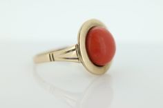 Amazing Statement ring. 8k yellow gold set with a Deep Orange CORAL cabochon gem. The Coral is round cabochon Condition: Shows little signs of wear. Details: 11mm orange Coral 16mm Round top table 8mm rise off finger 5.0grams total weight Marked 333 (8K) Size 8 Modern Domed Cabochon Rings, Fine Jewelry Domed Gemstone Cabochons, Domed Gemstone Cabochons Fine Jewelry, Formal Round Gemstone Cabochons, 14k Gold Dome Ring With Oval Cabochon Gemstone, Classic Round Cabochons With Bezel Setting, Formal Yellow Gold Cabochons With Bezel Setting, Modern Dome Ring With Cabochon, 14k Gold Dome Ring With Cabochon