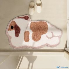 a brown and white dog rug sitting on top of a kitchen counter next to a pair of shoes