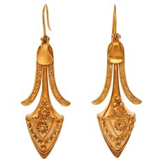 Circa 1880s, 14k, American. These nineteenth-century Etruscan revival earrings are elegant, flirty, and visually arresting. Fabulous length combined with exciting movement, fine detail, and a lovely patina makes them as fashionable today as they were over a hundred years ago. The look is neoclassical chic at its antique best! Finely made in fourteen-karat yellow gold, they are in excellent condition. Remarks: "The Victorians borrowed from everyone and we borrow from them. Fashion is now, style is forever!" SIZE: 2 1/4 inches long WEIGHT: 6.4 grams total STONES: none HALLMARKS: none, tested 14k STOCK NUMBER: 25090 Pieces acquired from this dealer must delight you. Purchases may be returned for any reason for a period of 7 days. Patina, Antique Jewelry, Style Me, Yellow Gold, Jewelry Earrings, Drop Earrings, Stone, Gold