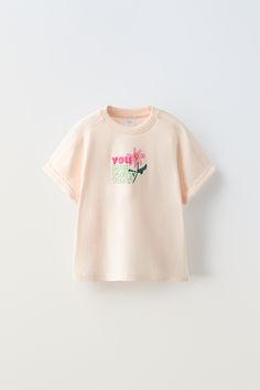 Summer Short Sleeve T-shirt With Embroidered Text, Pink Slogan T-shirt With Short Sleeves, Zara Short Sleeve T-shirt With Letter Print, Zara Pink Casual T-shirt, Trendy Crew Neck T-shirt With Embroidered Text, Basic Summer T-shirt With Logo Print, Cotton Graphic Tee For Spring, Spring Cotton Graphic Tee With Short Sleeves, Spring Graphic Tee Short Sleeve Cotton Top