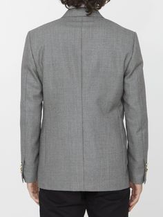 Double-breasted jacket in grey wool. It features peaked lapels, front four-button closure, two front welt pockets, a welt pocket on chest and buttoned cuffs. Regular fit. The model is 184cm tall and wears size IT 48.Size nationality: IT Product number: 37176789 Product code: 690661571901 Composition: 100% WOOL Luxury Semi-formal Tweed Jacket With Button Closure, Formal Wool Blazer With Button Closure, Formal Wool Blazer, Timeless Suits With Button Closure And Lapel Collar, Luxury Tweed Jacket With Lapel Collar And Button Closure, Winter Double Breasted Suit With Concealed Placket For Business, Winter Business Double Breasted Suit With Concealed Placket, Luxury Tweed Jacket With Button Closure For Formal Events, Luxury Formal Tweed Jacket With Button Closure