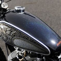 the back end of a motorcycle with intricate designs on it