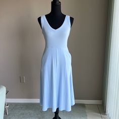 27.5” Waist To Hem 41.5” Top Of Non Adjustable Straps, V-Neck Front And Back Neckline Stretchy Ribbed Fabric Size: X-Small Color: Light Blue Side Hidden Pockets On Side Seams Pull-On Design 57% Cotton,38% Modal, 5% Spandex Casual Fitted V-neck Dress For Daywear, Stretch V-neck Midi Dress For Daywear, Blue V-neck Dress For Summer Daywear, Light Blue V-neck Dress For Daywear, Fitted V-neck Midi Dress For Loungewear, Stretch Midi Dress V-neck For Daywear, V-neck Midi Dress With Pockets For Daywear, Light Blue Stretch Casual Midi Dress, Casual Light Blue Stretch Midi Dress