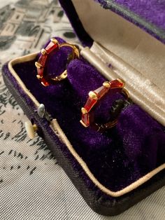 Magnificent vintage earrings in gold-plated and baguette-cut red stones. . elegant shape, superb design, set with garnet red color stone, in very good condition. box not included. Elegant Ruby Hoop Earrings For Anniversary, Classic Evening Ruby Jewelry, Vintage Gold Plated Hoop Jewelry, Vintage Gold-plated Hoop Earrings As A Gift, Vintage Gold-plated Hoop Earrings For Gift, Vintage Gold Plated Hoop Earrings As Gift, Vintage Gemstone Earrings For Anniversary, Vintage Jeweled Earrings For Formal Occasions, Classic Red Baguette-cut Jewelry