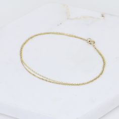 "14K Gold Dainty Double Chain Bracelet - 14K Solid Gold Bracelet ★ The chains and all components are 14K solid yellow gold The length includes the chain and the closure. Please measure your wrist before you place your order. ** How to choose a correct size of bracelet. 1. Measure your wrist below the wrist bone using a flexible tape measures, a string or a strip of paper. 2. If using a string or a strip of paper, mark length. Then, measure it with a ruler. 3. To find the bracelet size, add 1/2\" Yellow Gold Recycled Gold Bracelet As A Gift, Yellow Gold Recycled Gold Bracelet For Gift, Gift Yellow Gold Bracelet In Recycled Gold, 14k Yellow Gold Bracelet With Cable Chain, Tarnish Resistant Recycled Yellow Gold Bracelet, Gift Yellow Gold Chain Bracelet With Cable Chain, Yellow Gold Cable Chain Bracelet As Gift, Gift Yellow Gold Cable Chain Bracelet, Gold Double Chain Bracelet For Formal Occasions