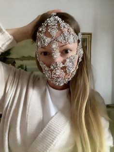 Silver Rhinestone Face Mask A silver crystal filigree mask that would be perfect for raves, festivals and weddings! This gorgeous face mask is designed with clear rhinestones, and crystals You will be the center of attention with these sparkling jewels at a party or to your wedding! This crystal it looks amazing under stage lights. The mask is fixed at the back with a chain Festival Masks, Silver Headpiece, Head Chain Jewelry, Bridal Crown Crystal, Face Chain, Face Rhinestones, Rhinestone Face Mask, Rhinestone Face, Silver Earrings Wedding