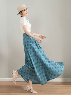 "Elevate your summer wardrobe with this gorgeous light blue polka dot skirt. The elegant midi length and the feminine polka dots create a lovely vintage vibe that will make you feel like a 1950s movie star.The flowy silhouette and the cute polka dots make it a perfect choice for a picnic or a stroll in the park. DETAIL * Tencel blend * High waisted skirt * Two side pockets * Polka dot detail * Plus size skirt * Circle skirt * Perfect summer spring skirt * Dry clean * The model is 168cm (5′ 6″) t Casual Light Blue Lined Maxi Skirt, Light Blue Beach Skirt, Casual Light Blue Long Maxi Skirt, Summer Casual Polka Dot Skirt, Summer Polka Dot Flowy Skirt, Light Blue Skirt With Pockets, Polka Dot Summer Bottoms With Pockets, Casual Light Blue Flared Skirt, Light Blue Long Skirt For Summer