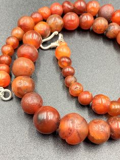 The Beautiful Roman's Era Dynasty Red Carnelian Agate Stone Jewelry Beads Necklace. The Age Of This Beads Are More Than 2000 Years Old. Conditions Of Beads As Shown In The Pictures. Rich In Patina. Red Carnelian Round Beads, Round Carnelian Necklaces With Natural Stones, Polished Round Carnelian Beads Jewelry, Carnelian Gemstone Beads Necklace, Polished Round Carnelian Beads, Gems, And Cabochons, Carnelian Gemstone Beaded Necklaces, Carnelian Beaded Necklaces With Gemstone Beads, Natural Carnelian Gemstones, Artisan Carnelian Round Beads Necklace