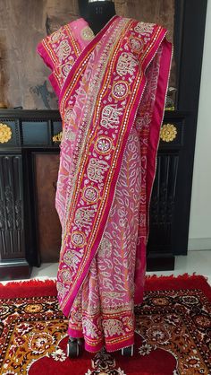 Our excellent workmanship  Our flagship gajji silk  pink shaded combination saree  handcrafted with beautiful BANDHANI/BANDHEJ work then glittering with zero size gota patti ,pearl work this is beautiful and luxurious drape for wedding.light golden work.with unstiched blouse piece . Luxury Bandhani Print Dola Silk Pre-draped Saree, Luxury Party Dupatta With Bandhani Print, Luxury Bandhani Print Paithani Silk Dupatta, Transitional Art Silk Saree With Mirror Work, Festive Pink Pre-draped Saree With Mirror Work, Navratri Multicolor Pre-draped Saree With Gota Work, Festive Pink Pre-draped Saree With Dori Work, Pink Silk Traditional Wear With Gota Work, Bandhani Print Pre-draped Saree For Puja