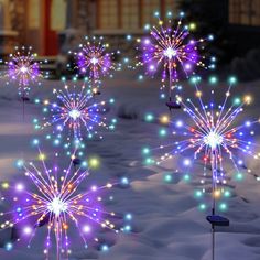 colorful fireworks are lit up in the snow