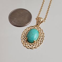 Elevate Your Style with Our Oval Filigree Turquoise Pendant Necklace 🌟Unleash your inner fashionista with our exquisite Oval Filigree Turquoise Pendant Necklace, a versatile accessory that effortlessly combines elegance and charm. Crafted with precision and passion, this necklace is designed to make a statement.The pendant's oval shape boasts an intricate filigree design that radiates sophistication and timeless beauty. Each delicate detail speaks volumes about the craftsmanship that went into Elegant Oval Turquoise Jewelry, Elegant Turquoise Oval Pendant Jewelry, Elegant Oval Turquoise Necklace As Gift, Elegant Oval Turquoise Necklace For Gift, Elegant Oval Turquoise Necklace Gift, Elegant Turquoise Necklace With Round Pendant, Elegant Turquoise Necklace With Oval Pendant, Elegant Turquoise Cabochon Necklace, Gold Turquoise Oval Necklace