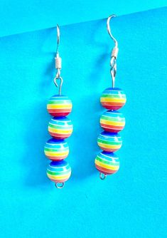 Ball rainbow stacker dangle earrings are fabulous and will go with any outfit because of their rainbow colours. The hook is made of plated sterling silver to protect your ears and the balls are made of Resin.  They come well presented and wonderful for a present for a friend, family or your loved one. I can gift wrap and post to an alternative address if they are a gift for a friend or relative.  Thank you for taking the time to look at my earrings and please visit my shop for more original desi Vibrant Rainbow Dangle Earrings, Hypoallergenic Multicolor Sterling Silver Earrings, Colorful Vibrant Earrings With Ear Wire, Fun Rainbow Hypoallergenic Jewelry, Colorful Playful Dangle Earrings, Colorful Playful Dangle Jewelry, Playful Colorful Dangle Jewelry, Vibrant Rainbow Drop Earrings, Fun Colorful Dangle Earrings