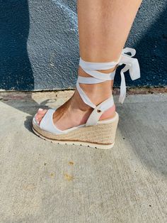 Step into style with our Ankle Lace Up Espadrille Wedge Sandals! These unique and playful shoes feature a lace up ankle design, combining fashion and function. The espadrille wrapped wedge adds a touch of quirkiness to any outfit. Say goodbye to boring, basic sandals and step up your shoe game with these fun and fashionable wedges! Casual Adjustable Lace-up Heels, Adjustable Lace-up Platform Wedge Sandals, Casual Lace-up Wedge Sandals With Woven Sole, Casual Synthetic Wedge Heel Lace-up Sandals, Casual Lace-up Wedge Heel Sandals, Adjustable Lace-up Wedge Sandals For Spring, Spring Lace-up Espadrille Wedge Sandals, Spring Lace-up Adjustable Wedge Sandals, Casual Lace-up Wedge Sandals For Spring