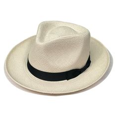 The Stetson Retro Panama Straw Fedora is your classic handwoven, panama style hat but with a bit of a Stetson twist. This hat is a genuine Panama hat meaning it's hand made from South American Toquilla tree fibers, giving this hat a unique charm thats 100% authentic. The hat also features a stylish grosgrain hat band in black to accent the natural colored fibers this hat is made from.Brim: 2.5"Crown: 4" Formal Wide Brim Sun Hat In Toquilla Straw, Formal Toquilla Straw Sun Hat With Wide Brim, Formal Wide Brim Hat In Natural Color, Classic Panama Hat For Travel, Elegant Flat Brim Toquilla Straw Hat, Woven Panama Hat With Curved Brim, Elegant Brimmed Panama Hat In Toquilla Straw, Formal Flat Brim Panama Hat For Summer, Natural Panama Hat For Formal Summer Occasions