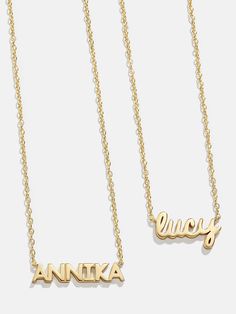 Spell it out with the 18K Gold Mini Nameplate Necklace. This custom name piece features a modern gold chain attached to your choice of a pavé or gold nameplate. Featuring the personalization of your choosing. Crafted with 18K gold plated sterling silver and Cubic Zirconia stones, you'll be wearing it for years to come. Luxury Nameplate Necklace For Personalized Gift, Luxury Personalized Nameplate Necklace, Luxury Personalized Initial Pendant Name Necklace, Yellow Gold Nameplate Necklace, Birthstone Nameplate Necklace, Luxury Gold Nameplate Necklace, Luxury Customizable Nameplate Necklace, Luxury Gold Name Necklace With Custom Name, Luxury Gold Custom Name Necklace