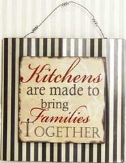 a sign hanging on the wall that says kitchens are made to bring families together,