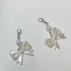 This small and coquette is sure to add a bit of elegance to any bag!  Size: 2" (inches) Elegant Bag Charm With Charms As Gift, Elegant Bag Charm For Everyday Use, Elegant Bag Charm With Lobster Clasp For Gift, Elegant Bag Charm With Lobster Clasp As Gift, Elegant Everyday Bag Charm, Coquette Bag, Pastel Backpack, Small Keychain, Backpack Keychain