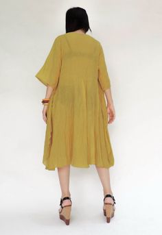 "🚚..ALL ORDERS ARE SHIPPED VIA DHL EXPRESS MAIL An easy flatter floral appliqué tunic dress with round neck, short sleeves, side seam pockets. The front piece is sewn to the neck line and shoulder then let it hanging down to the side seam, look like a wing. This will create aflutter while you are moving. Terrific with long skirts, pants, leggings or alone as a flirty summer dress. NOTE: You may want to wear inner-wear when wearing this soft cotton tunic dress. As it can see through when you are Non-stretch Solid Color Dress For Daywear, Casual Plain Spring Dress, Daywear Solid Color Shift Midi Dress, Non-stretch Short Sleeve Dress For Daywear, Solid Color Shift Midi Dress For Daywear, Spring Solid Color Relaxed Fit Midi Dress, Solid Midi Dress With Relaxed Fit For Spring, Solid Color Relaxed Fit Midi Dress For Spring, Solid Color Shift Dress For Daywear