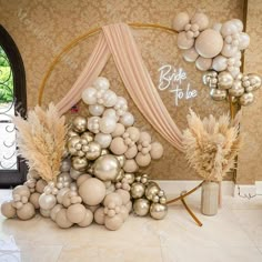 balloons are arranged in the shape of a christmas tree on display at a wedding reception