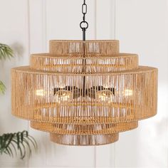 This chandelier adds a rustic and boho vibe to your room and get a lot of complimentst.It boasts a sophisticated blend of natural rattan and metal frames, exuding a vintage bohemian charm.The design features circular wrought iron frames in five tiers are… Woven Chandelier, Boho Chandelier, Rattan Shades, Drum Chandelier, Woven Rattan, Metal Frames, Black Hand, Lighting Store, Boho Vibe