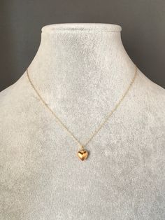 "A sweet and simple 24k solid matte gold vermeil heart charm dangles from a 14k gold filled chain. The chain is adjustable and can be worn close to the neck at 16\" or a little longer at 18\". It is finished with a spring ring clasp. Please send a message if a longer chain is desired. Wear this necklace by itself or as a layering piece. A perfect gift for Valentine's Day, birthday, anniversary or bridal party. Multiple quantities can be special ordered. Heart charm: 9x9mm Total length of pendant Chain With Heart Pendant, Simple Gold Heart Necklace, Gold Chain With Heart Pendant, Small Gold Heart Necklace, Small Pendant Necklace Gold, Gold Heart Pendant Necklace, Small Pendant Design, Small Chains Gold With Pendant, 14k Gold-filled Heart Necklace With Heart Charm