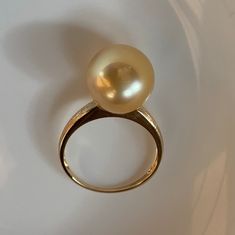 Stunning Big South Sea Golden Pearl Ring, 11.8mm, Bright Rich Gold Color, Very High Luster, Absolutely Stunning.   Solid 18k Yellow Gold, Very Well made and Comfortable to wear. US Size 7.5. Elegant and stunning. Something you can wear forever.  Classic and Elegant     Lustrous beauty  Pearl ★ Genuine South Sea Golden Pearl ★ Size: 11.8mm ★ Shape: Near Perfect Round ★Color: Natural Untreated, Bright Sunny Gold, Beautiful ★ Surface: Nice, Baby Smooth and Mirror Like, Mostly Very Clean, gentle texture not visible when wear Ring ★ Metal: Solid 18k Yellow Gold, Very Well made and Comfortable to wear ★ Size: US Size 7.5 Shipping FREE with USPS First Class in US. Yellow Gold Pearl Ring With High Luster, Fine Jewelry Yellow Gold Pearl Ring With High Luster, Classic Gold Pearl Ring With High Luster, Timeless Gold Rings With High Luster, Yellow Gold Fine Jewelry Rings With High Luster, High Luster Yellow Gold 14k Ring, 14k Yellow Gold High Luster Pearl Ring, Fine Jewelry Yellow Gold Rings, 14k Gold Pearl Ring With Polished Finish