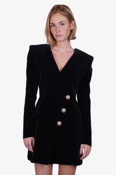 Balmain Black Velvet Gold Button Blazer Dress. V-neck. Rear zip closure. Lined. Gold-tone hardware. Tonal stitching.Original Retail Price: $2,795Size: 4 Condition: This item is in good pre-loved condition with a scuff mark on the left shoulder. Gold Buttons, Blazer Buttons, Blazer Dress, Black Velvet, V Neck, Velvet, Blazer, Gold, Black