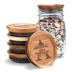 a jar filled with lots of food next to some wooden coasters on top of each other