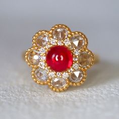 "This ring features 1 pieces of earth-mined  Burmese Jedi Spinel with the most fascinating neon red color.  The size 6.5 ring is made of solid 14K gold can be sized up or down for $65 if needed. This item is brand new and was appraised by a gemologist.  The certificate will be included and describes the spinel as follows: \"Shape And Cut: Round Cabochon Weight: 1.1ct Species: Natural Spinel Colour: Vivid Red Transparency: Transparent Luster: Brilliant Refractive Index: 1.718 Condition: Brand New Exquisite Ruby Ring With Diamond Round Cut, Exquisite Ruby Ring With Diamond In Round Cut, Elegant Ruby Ring With Rose Cut Diamonds For Wedding, Luxury Ruby Diamond Ring With Rose Cut Diamonds, Fine Jewelry Ruby Ring With Rose Cut Diamonds, Fine Jewelry Cluster Ring With Rose Cut Diamonds, Fine Jewelry Sapphire Rose Cut Diamonds For Wedding, Exquisite Ruby Ring With Prong Setting, Ruby Ring With Rose Cut Diamonds And Cubic Zirconia