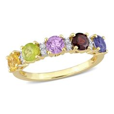 Steal her heart with this Multi-Color Stone Stackable Ring & Anniversary Band. Crafted in lustrous yellow plated sterling silver, it features 17 round-cut, prong-set flickering multi-color gemstones (4 x 4mm) studded on its band. Polished to a brilliant shine, this ring is the perfect addition to any jewelry collection. Birthstone Rings For Mom, Pretty Wedding Bands, Rings For Mom, Ring Redesign, Family Ring, Mothers Ring, Multi Gemstone Ring, Birthstone Rings, Montana Wedding